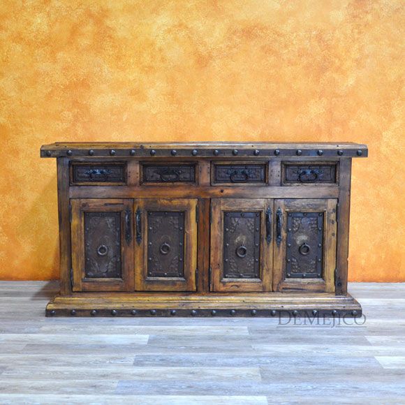 The Buffet Antigua metal buffet table is made from reclaimed wood .